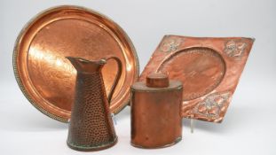 A collection of Arts and Crafts copper items. Including an engraved copper tea caddy with central