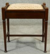 A C.1900 mahogany music stool with lift up seat and sheet music compartment. H.55cm