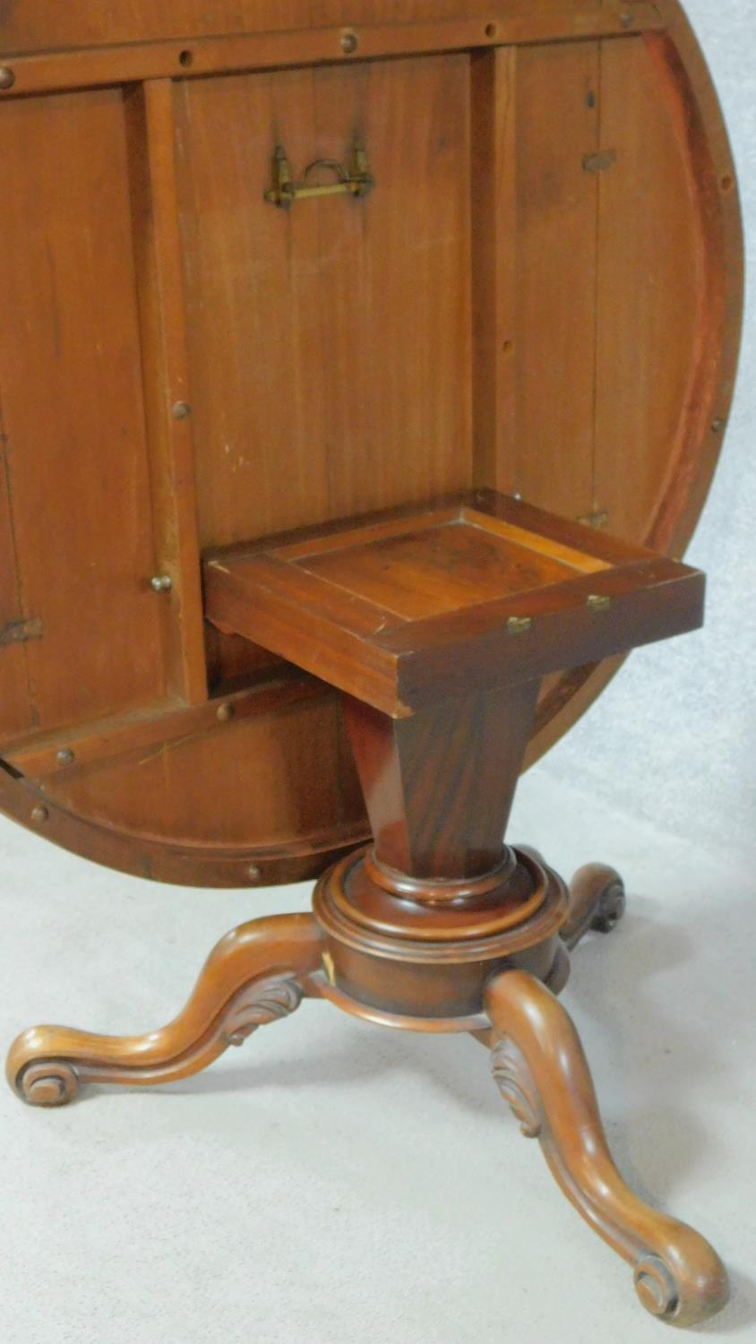 A Victorian mahogany tilt top dining table on tripod carved cabriole supports. H.68 W.122 D.122cm - Image 4 of 5