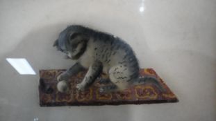 A framed and glazed Victorian embossed paper relief watercolour of a kitten on a coloured mat with