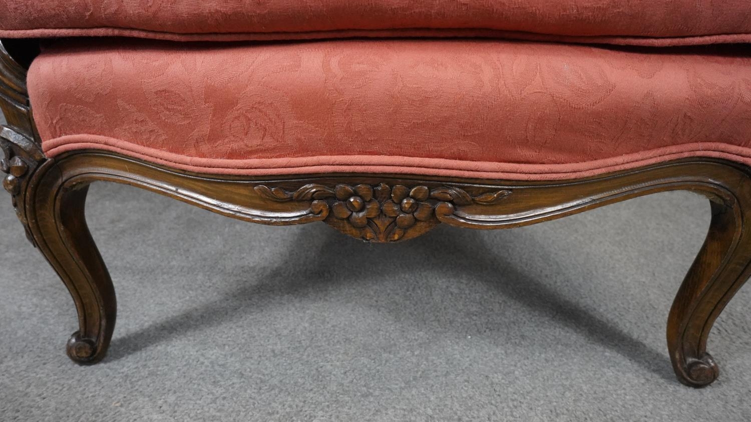 A Louis XV style carved walnut framed armchair in floral blush upholstery on cabriole supports. H. - Image 5 of 5