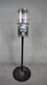 A vintage coin operated Beaver brand sweet machine. H.108 W.37 D.37cm