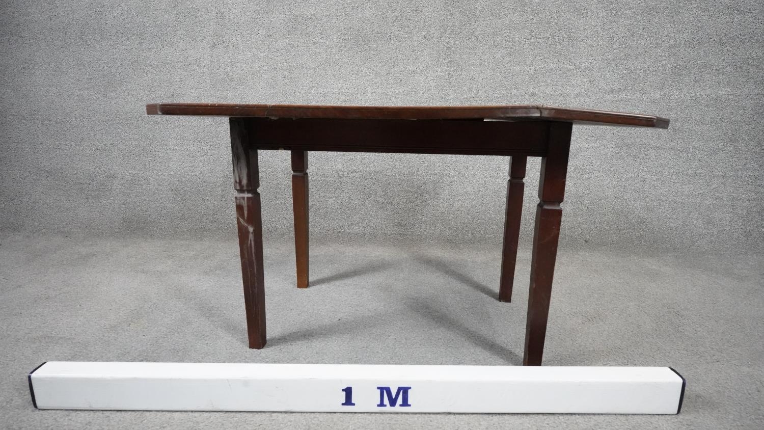 A 19th century mahogany drop flap table on square tapering supports. H.46 W.75 D.61cm - Image 6 of 6