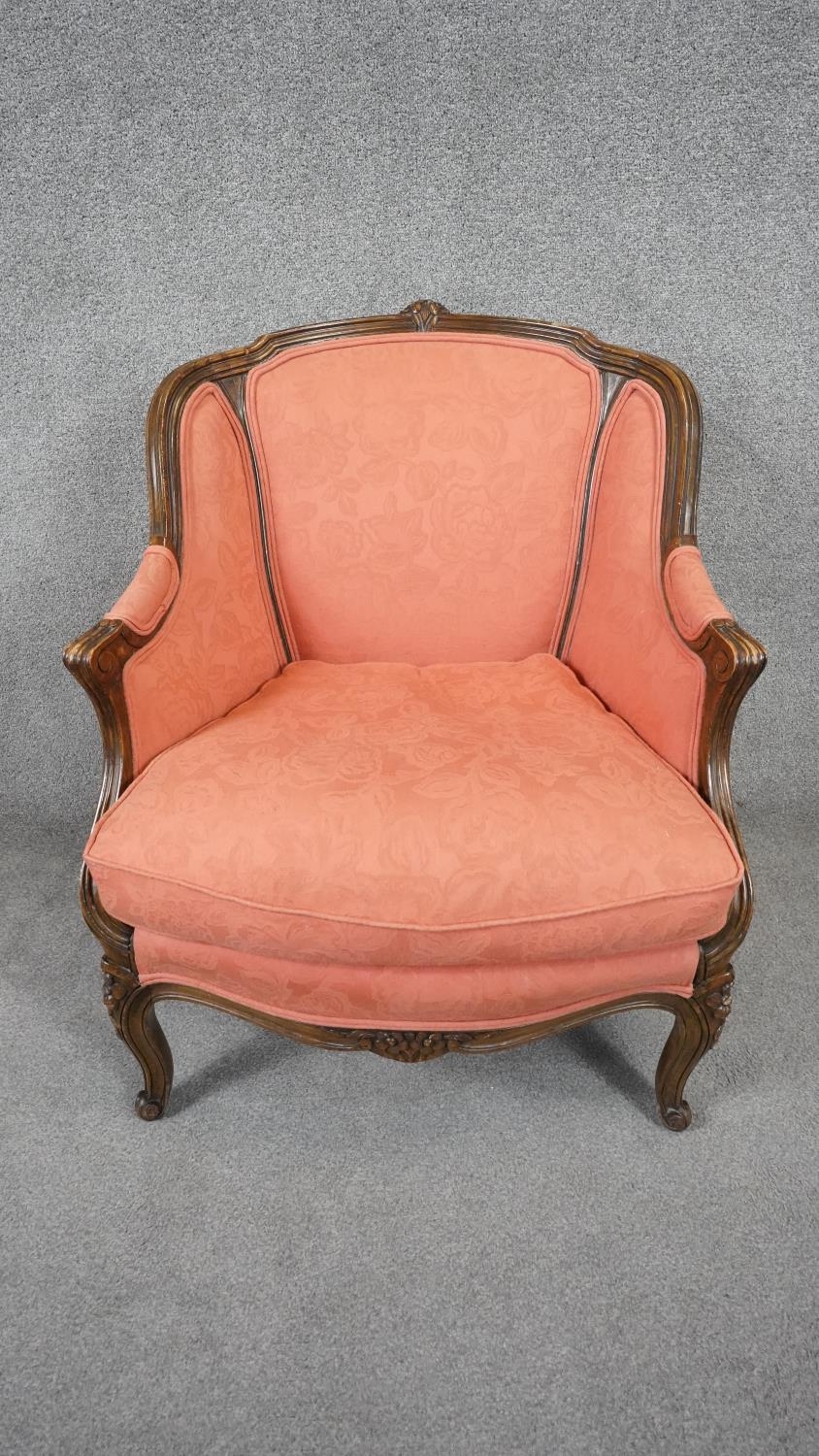 A Louis XV style carved walnut framed armchair in floral blush upholstery on cabriole supports. H. - Image 2 of 5