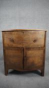 A Georgian mahogany and crossbanded bedside cabinet on shaped swept bracket feet. H.71 W.65 D.39