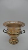 A silver plated two handled campana wine cooler with shell motifs to the handles. Inscribed EPC, R&D