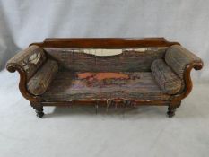 A Victorian mahogany framed double scroll end sofa with long squab cushion and end bolsters on