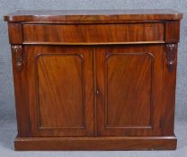 A 19th century mahogany chiffonier with serpentine top above frieze drawer on plinth base. H.89 W.