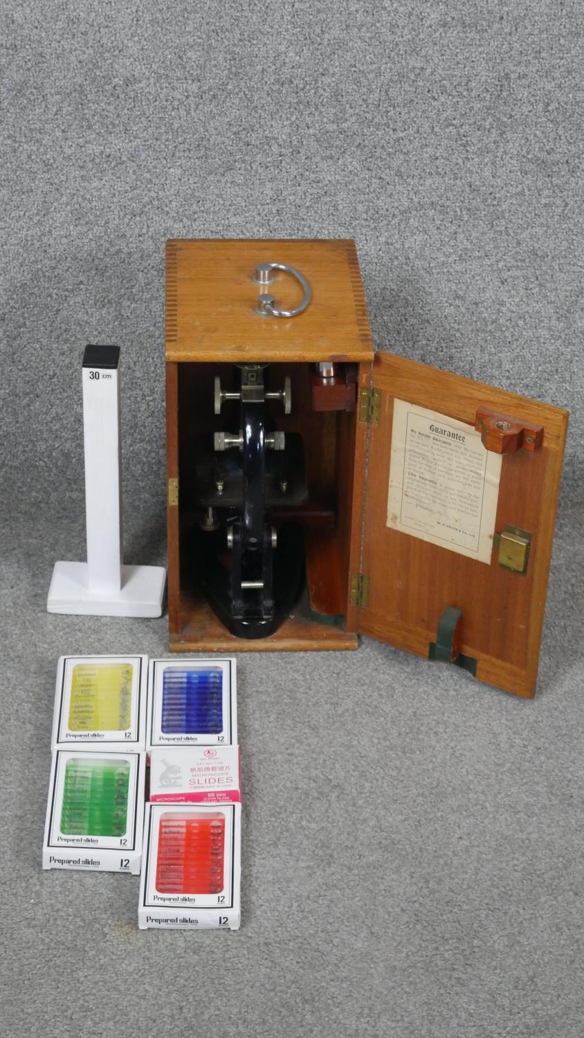 A vintage wooden cased W R Prior London microscope, model number 13377. With prepared slides and - Image 11 of 11