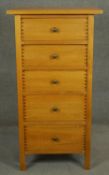 A contemporary fruitwood pedestal chest of five drawers. H.125 W.66 D.48cm