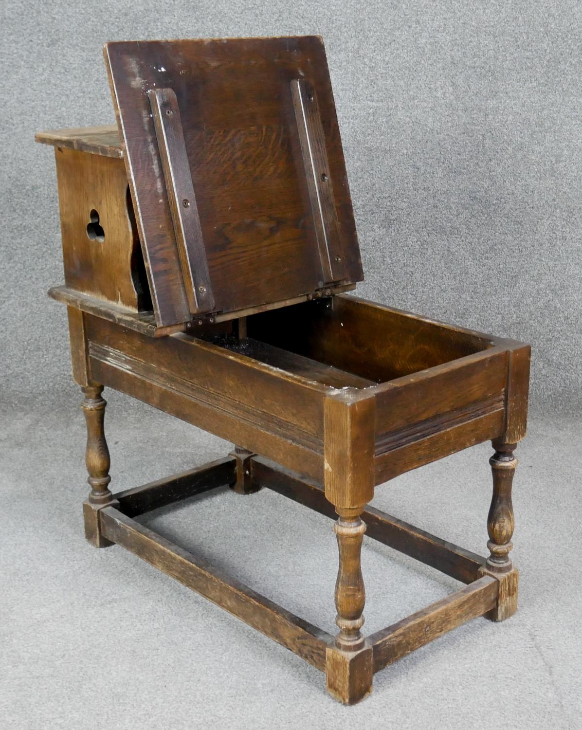 A Jacobean style oak hall table with hinged lidded compartment on turned stretchered supports. H. - Image 2 of 4