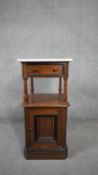 A 19th century Continental walnut, ebonised and inlaid pot cupboard with marble top. H.86 W.39 D.