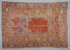A Kazak prayer rug with star motifs on a burgundy ground. L.160 W.108cm