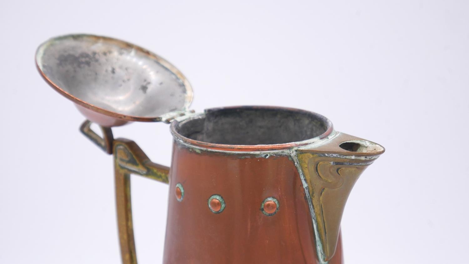 A WMF Art Nouveau copper and brass foliate design jug and circular charger. Ostrich makers stamp - Image 5 of 7