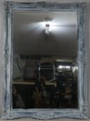 A very large wall mirror with bevelled plate in distressed Rococo style frame. H.216 W.154cm