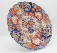 A Meji Period Japanese Imari ware scalloped edge porcelain plate. Decorated with birds and