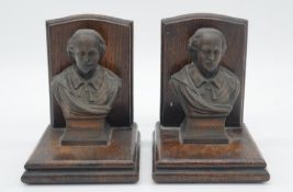 A pair of vintage oak bookends mounted with copper busts of Shakespeare. H.14cm