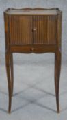 A French fruitwood night table with tambour shutter on slender cabriole supports. H.74cm