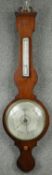 A Georgian mahogany wheel barometer with silvered dial. H.107cm (Mercury tube missing as