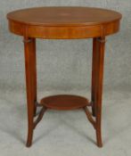 An Edwardian mahogany and satinwood inlaid occasional table with central conch shell inlay. H.73cm