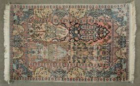 An Indian Kashmir rug with all over floral panel design. L.126 W.79cm