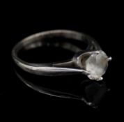 A 14 carat white gold cubic zirconia solitaire ring. Shank stamped 14k. Size K
