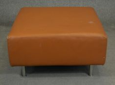 A contemporary Hay 'Mags' footstool upholstered in light tan leather. H.44 W.92 D.80cm