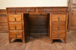 A mid century oak three section desk with inset leather top on block feet. H.77 W.124 D.66cm