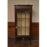 An Edwardian mahogany and satinwood inlaid display cabinet. H.144 W.66 D.33cm (with key)