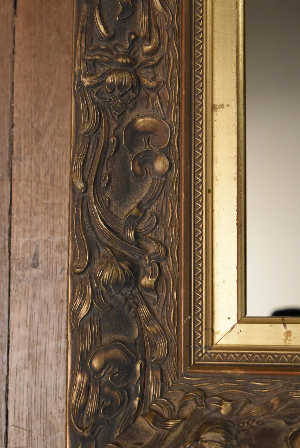 A late 19th century gilt wood and gesso wall mirror with scrolling Art Nouveau style decoration. H. - Image 2 of 4