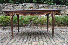 A French style burr walnut and crossbanded extending dining table with profuse floral inlay and