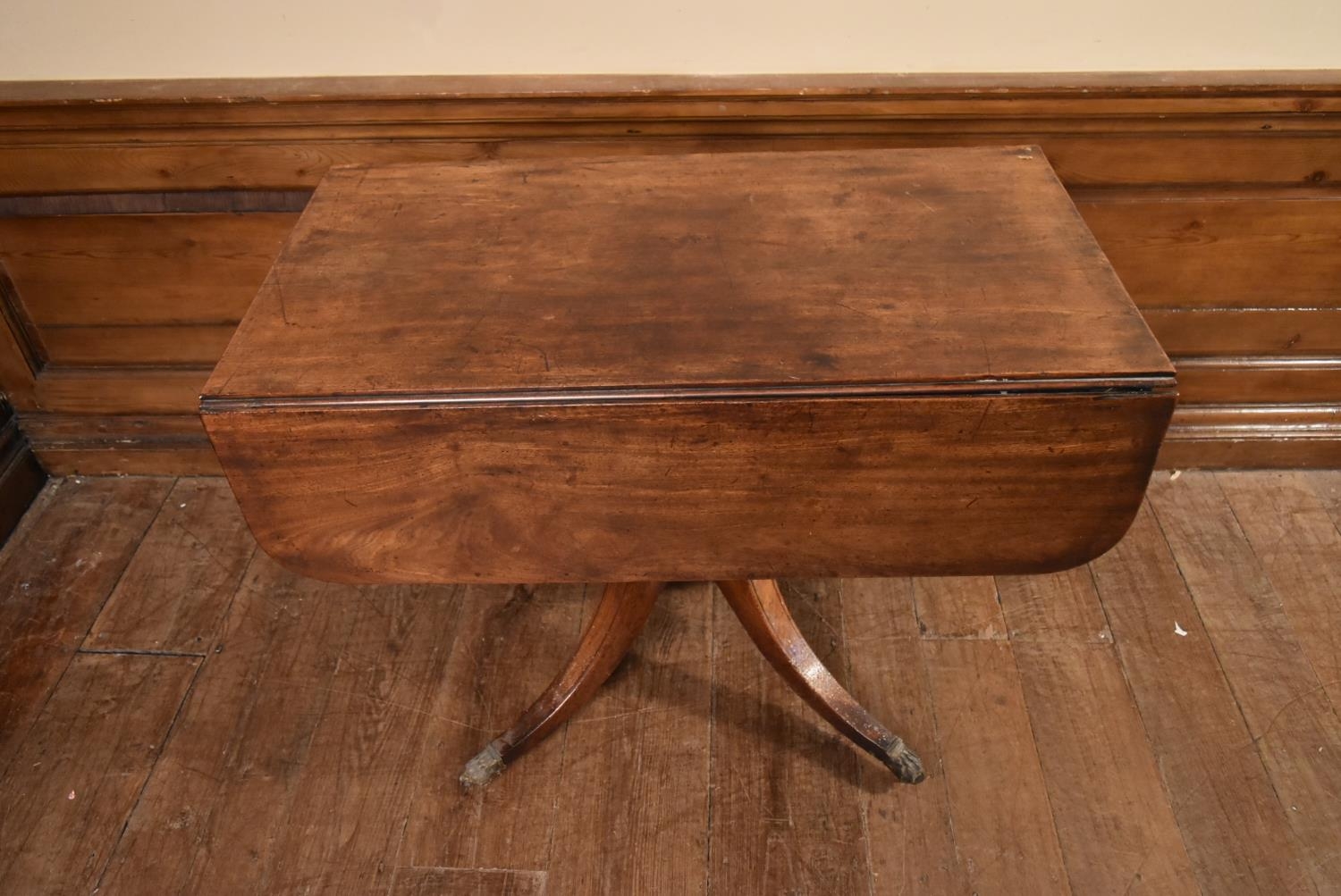 A Regency mahogany drop flap Pembroke table on quadruped swept supports terminating in brass lion' - Image 2 of 6