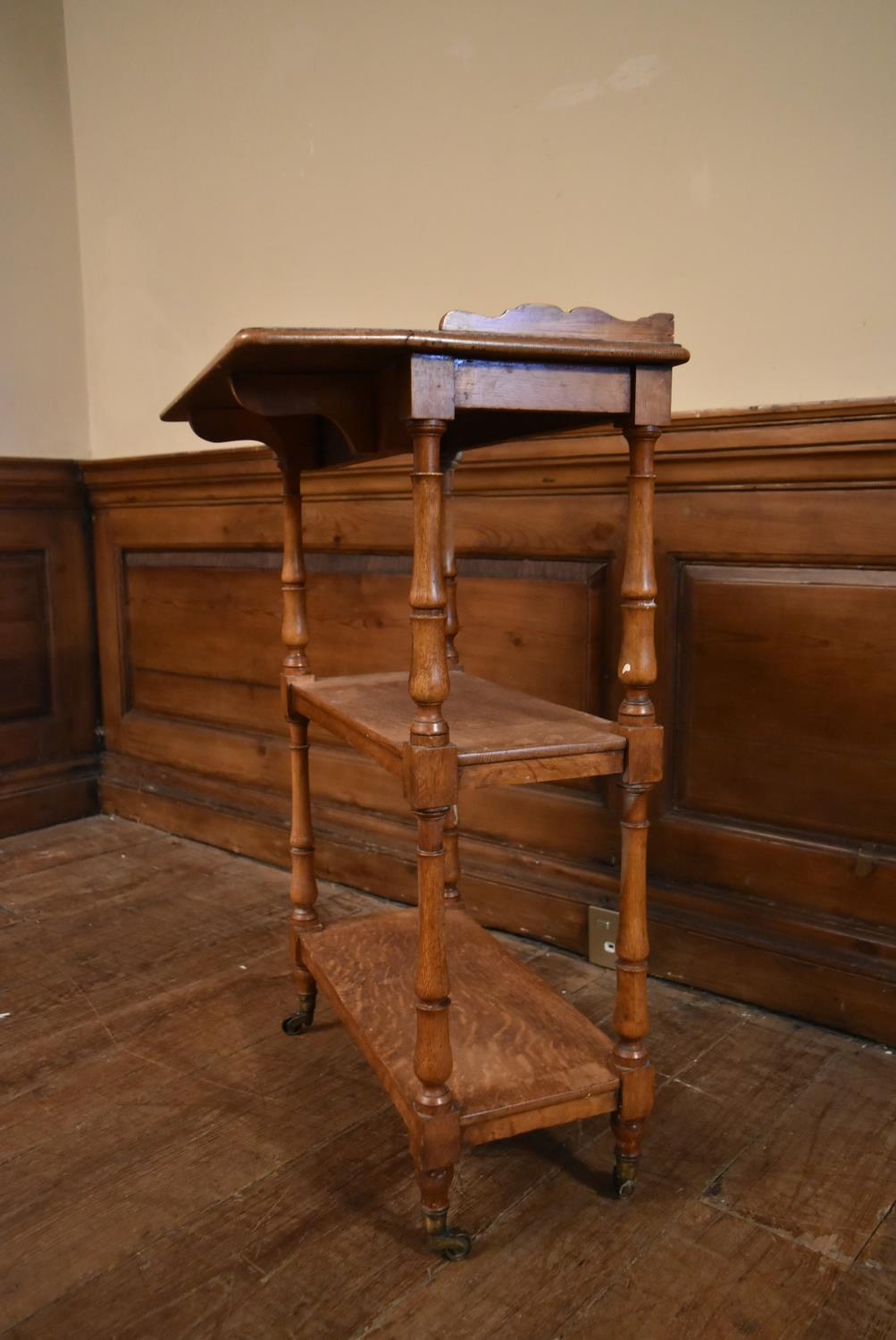 A late 19th century oak drop flap three tier buffet whatnot on turned supports terminating in - Image 8 of 10