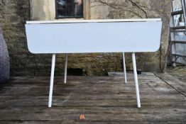A vintage Formica and metal framed drop flap kitchen dining table. H.70 W.110 D.60cm (ext.110cm)