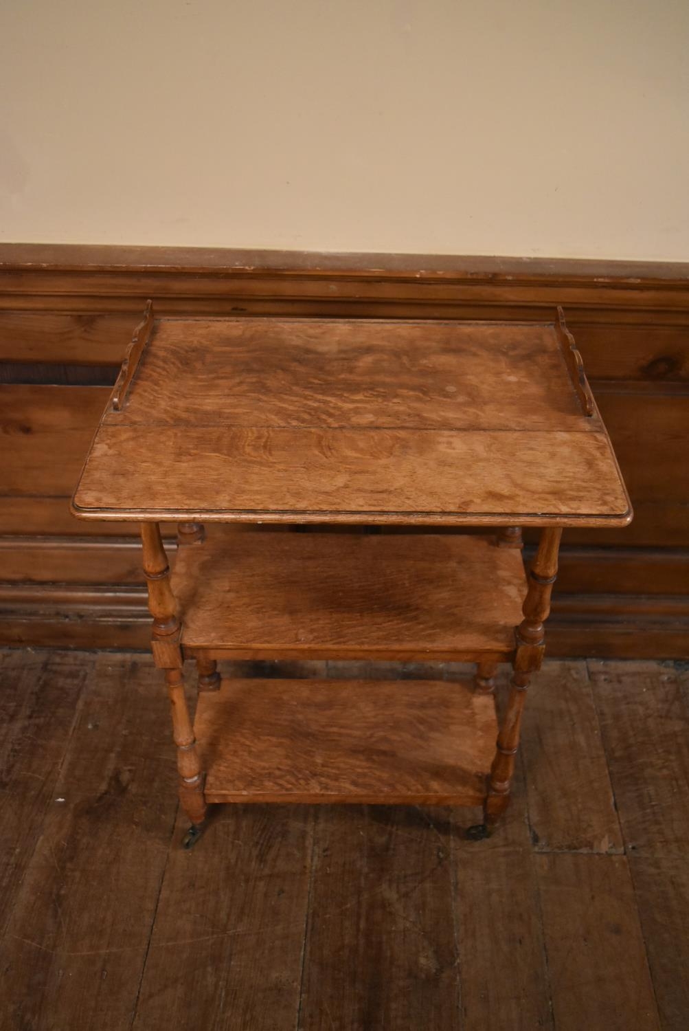 A late 19th century oak drop flap three tier buffet whatnot on turned supports terminating in - Image 5 of 10