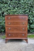 A small Georgian style mahogany and satinwood inlaid chest of drawers on swept bracket feet. H.77