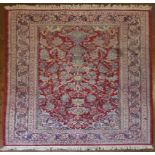 An Indian Jaipur rug on a red ground with a medallion motif. H.219 W.127cm