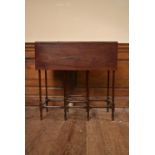 A 19th century mahogany drop flap spider leg table on turned stretchered supports. H.74 W.71 D.