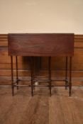 A 19th century mahogany drop flap spider leg table on turned stretchered supports. H.74 W.71 D.
