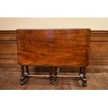 A 19th century mahogany drop flap Sutherland table on turned supports. H.75 W.28/104 D.92cm