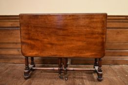 A 19th century mahogany drop flap Sutherland table on turned supports. H.75 W.28/104 D.92cm