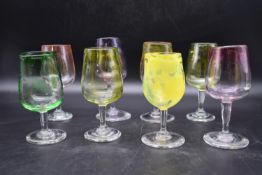 A set of eight hand blown Murano style colourful art glass wine glasses with speckled design and