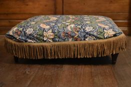 An upholstered stool on turned supports in William Morris style loose cover. H.39 W. 110 D.90cm