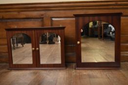 Two mahogany wall cabinets.