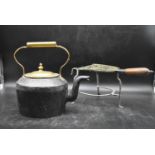 A 19th century copper and iron kettle and lid along with a trivet. H.33 W.33 Dia.24cm (2)