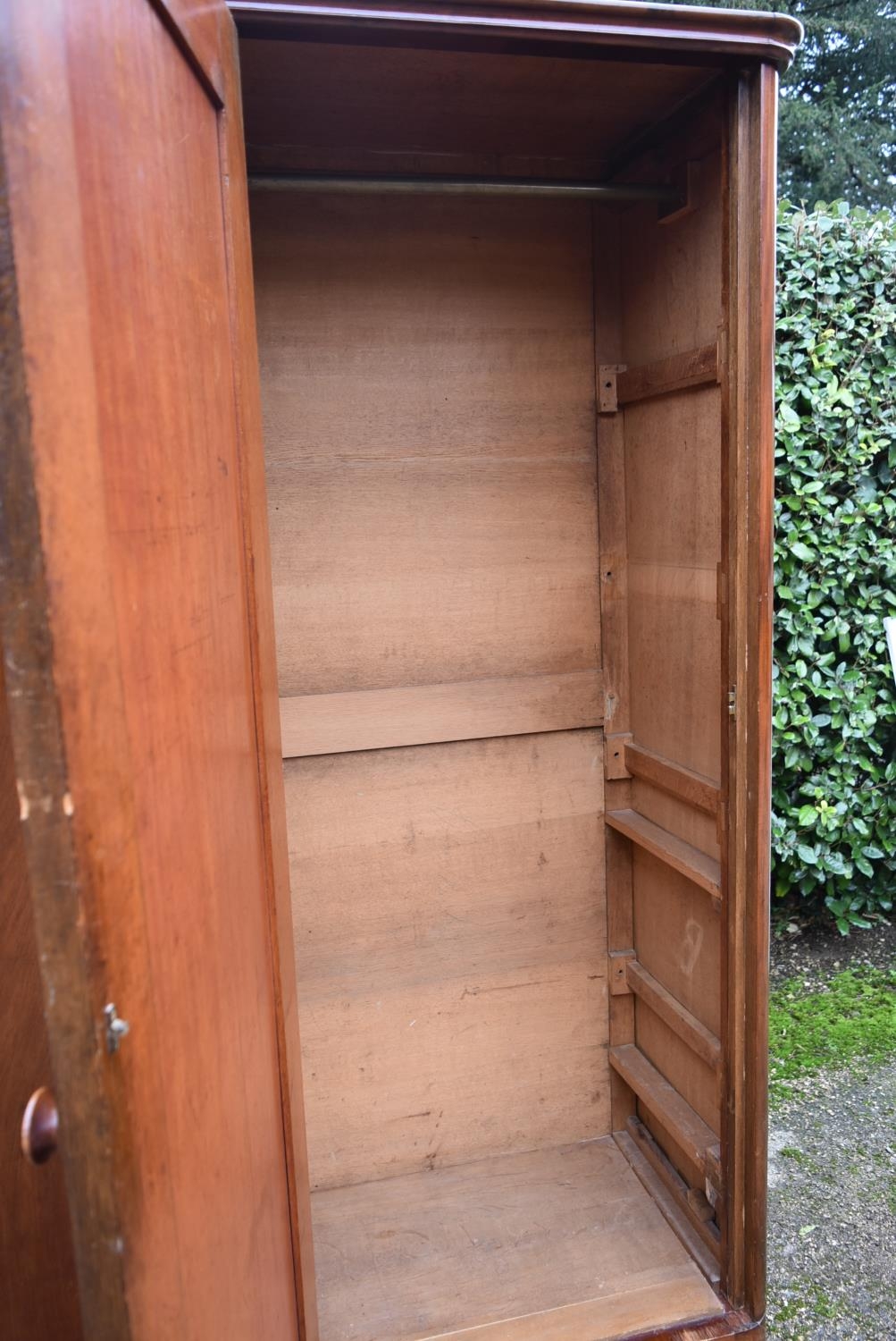 A 19th century flame mahogany two section wardrobe with panel doors enclosing full height hanging - Image 5 of 9