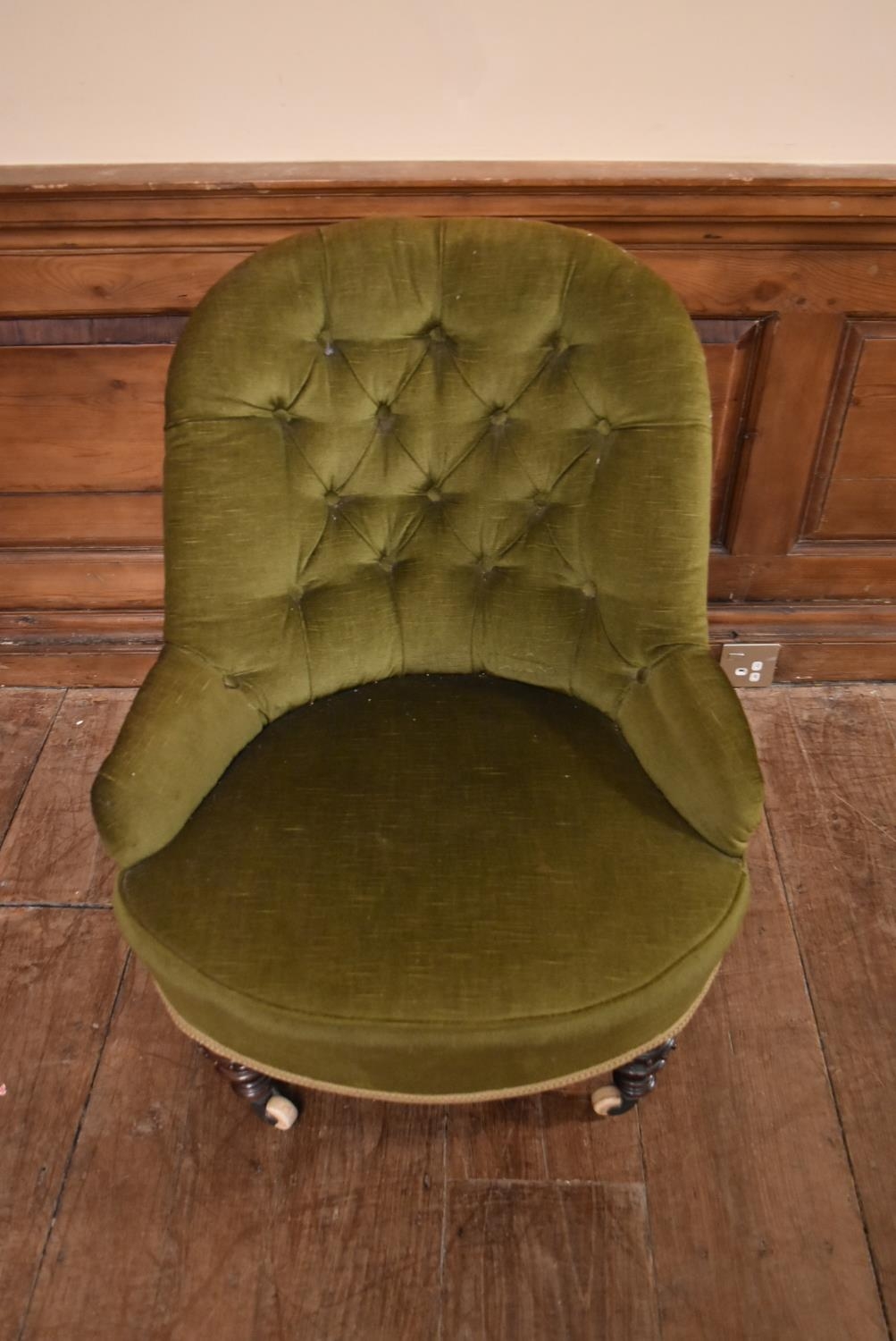 A Victorian tub shaped nursing chair in buttoned upholstery on turned tapering supports resting on - Image 2 of 5