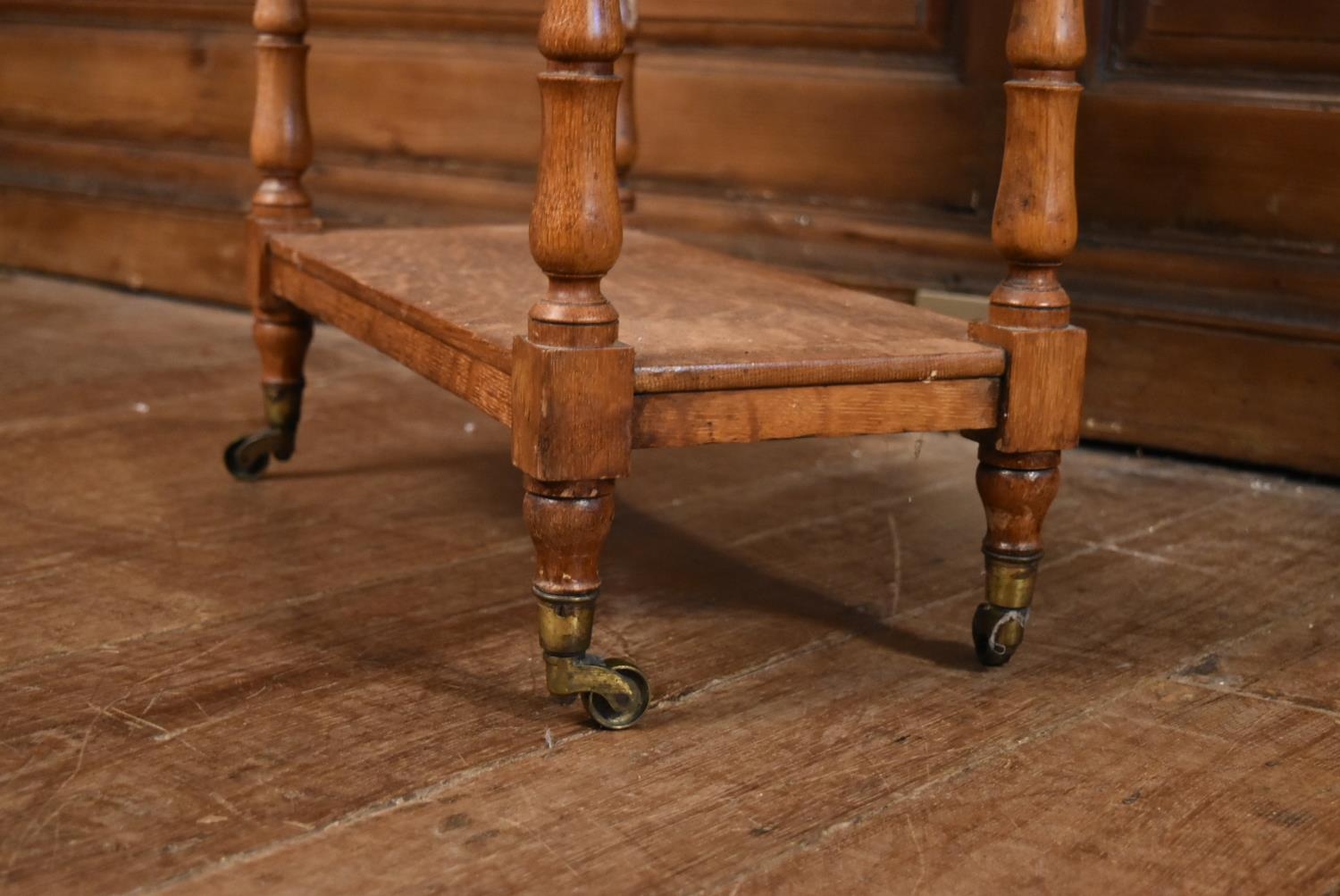 A late 19th century oak drop flap three tier buffet whatnot on turned supports terminating in - Image 9 of 10