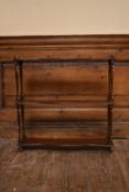 A set of 19th century mahogany wall shelves on turned supports. H.59 W.60 D.13cm