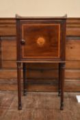 A Georgian mahogany and satinwood inlaid bedside cabinet with circular floral patera to the panel